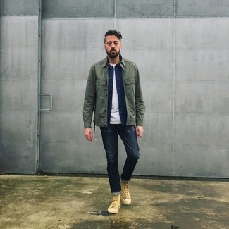 Olive Shirt Jacket Outfits For Men: This laid-back combination of an olive shirt jacket and navy jeans will catch attention for all the right reasons. Why not add a pair of beige canvas high top sneakers to the mix for a more relaxed spin?