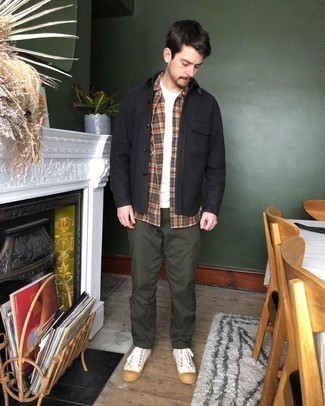 Black Shirt Jacket Outfits For Men: This combination of a black shirt jacket and olive chinos spells rugged elegance and class. Feeling experimental? Mix things up by wearing white canvas high top sneakers.