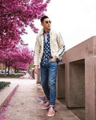 Yellow Low Top Sneakers Outfits For Men: This off-duty combo of a beige shirt jacket and blue jeans is a safe bet when you need to look cool in a flash. Introduce yellow low top sneakers to the mix to easily bump up the wow factor of this outfit.