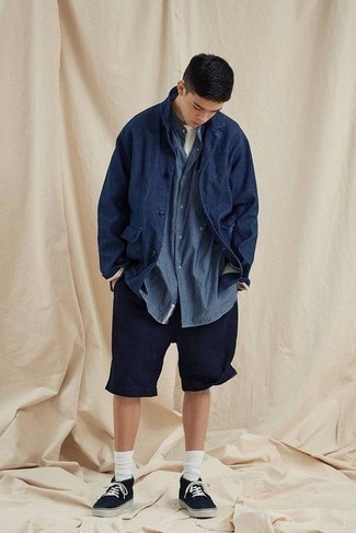 Blue Chambray Short Sleeve Shirt Outfits For Men: Why not dress in a blue chambray short sleeve shirt and navy shorts? As well as very functional, these pieces look cool paired together. A pair of black canvas low top sneakers is a surefire footwear style here that's full of character.
