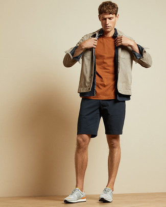 Grey Athletic Shoes Outfits For Men: This casual combo of a beige suede shirt jacket and navy seersucker shorts is very easy to throw together without a second thought, helping you look on-trend and prepared for anything without spending too much time combing through your wardrobe. You can follow a more casual route in the footwear department by finishing off with grey athletic shoes.