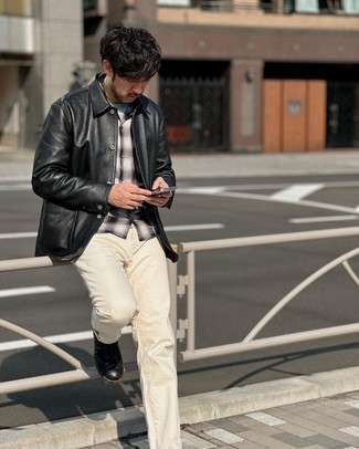 Black Leather Shirt Jacket Outfits For Men: You'll be amazed at how easy it is for any guy to throw together this casual look. Just a black leather shirt jacket and beige jeans. Now all you need is a cool pair of black leather casual boots.