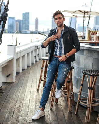 Blue Vertical Striped Short Sleeve Shirt Outfits For Men: Who said you can't make a fashionable statement with a relaxed look? Draw the attention in a blue vertical striped short sleeve shirt and blue print jeans. White low top sneakers are the glue that will tie your ensemble together.