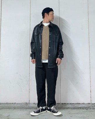 Black Leather Shirt Jacket Outfits For Men: This pairing of a black leather shirt jacket and black chinos oozes refined elegance. For a modern hi/low mix, enter black and white canvas low top sneakers into the equation.