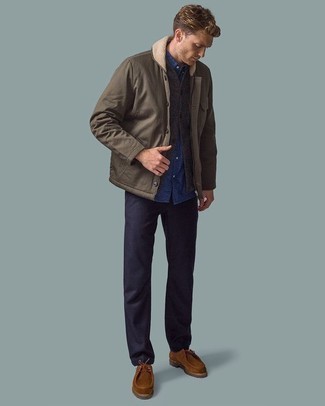 Sweater Vest Outfits For Men: A sweater vest and navy chinos are an easy way to introduce extra sophistication into your daily casual repertoire. Infuse a more relaxed finish into this look by sporting a pair of brown suede desert boots.