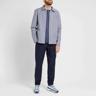 Blue Sweatshirt Outfits For Men: If you don't like being too serious with your outfits, try pairing a blue sweatshirt with navy chinos. If you wish to effortlessly dress down your look with one single piece, why not complement this outfit with a pair of white and blue athletic shoes?