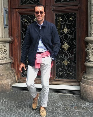 Pink Sweatshirt Outfits For Men: This pairing of a pink sweatshirt and beige chinos is hard proof that a pared down casual outfit doesn't have to be boring. Add a pair of tan suede boat shoes to your look for maximum impact.