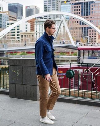 Navy Wool Shirt Jacket Outfits For Men: Exhibit your chops in men's fashion by teaming a navy wool shirt jacket and khaki cargo pants for a relaxed getup. Complete this look with white low top sneakers to make a dressy ensemble feel suddenly edgier.