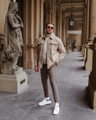 Tan Wool Shirt Jacket Outfits For Men: If the setting permits casual dressing, try teaming a tan wool shirt jacket with khaki check chinos. White and black leather low top sneakers are a surefire way to give a dash of stylish effortlessness to your outfit.