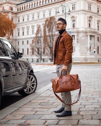 Tobacco Leather Holdall Outfits For Men: This casual and cool getup is really pared down: a tobacco shirt jacket and a tobacco leather holdall. A pair of black leather chelsea boots instantly revs up the classy factor of your outfit.