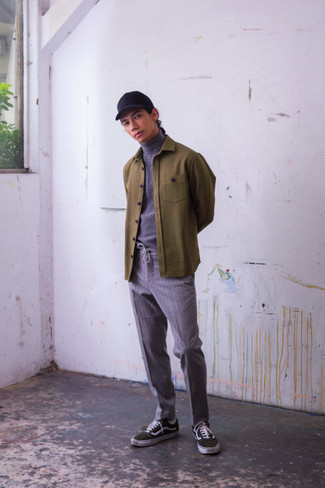 Dark Green Canvas Low Top Sneakers Outfits For Men: Reach for an olive shirt jacket and grey vertical striped chinos to put together an interesting and modern-looking laid-back outfit. Finishing off with a pair of dark green canvas low top sneakers is a guaranteed way to add a mellow touch to this outfit.