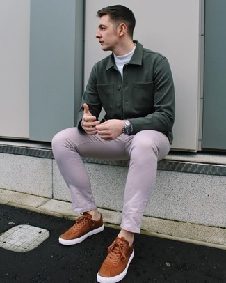 Brown Leather Low Top Sneakers Outfits For Men: This pairing of a dark green shirt jacket and pink chinos is a real lifesaver when you need to look on-trend but have zero time. When this look looks too dressy, dial it down by finishing with a pair of brown leather low top sneakers.