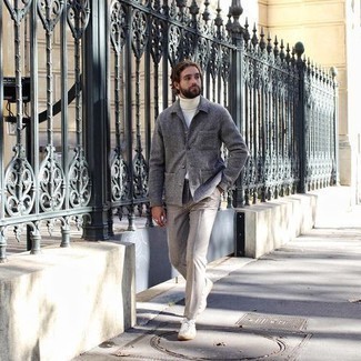Charcoal Wool Shirt Jacket Outfits For Men: Go all out in a charcoal wool shirt jacket and beige dress pants. Finishing off with a pair of white canvas low top sneakers is the simplest way to add a hint of stylish effortlessness to your ensemble.