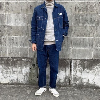 Men's Outfits 2021: To achieve a relaxed casual outfit with a contemporary spin, opt for a navy denim shirt jacket and navy jeans. A pair of white canvas low top sneakers effortlessly ups the street cred of this ensemble.