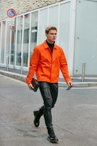 Black Leather Jeans Outfits For Men: This laid-back pairing of an orange shirt jacket and black leather jeans is super easy to throw together in seconds time, helping you look dapper and ready for anything without spending too much time going through your wardrobe. Let your sartorial expertise truly shine by complementing this outfit with black leather casual boots.