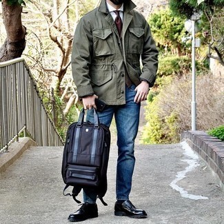 Blue Canvas Backpack Outfits For Men: An olive shirt jacket and a blue canvas backpack are essential in any modern gent's functional off-duty closet. For something more on the dressier end to complete your ensemble, grab a pair of black leather derby shoes.