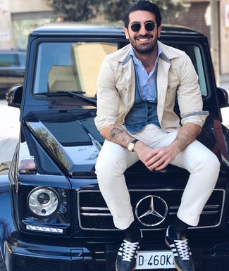 Blue Denim Waistcoat Outfits: Hard proof that a blue denim waistcoat and white chinos look amazing if you pair them together in an elegant getup for a modern man. Give a fresh twist to an otherwise all-too-safe outfit by rocking navy leather low top sneakers.
