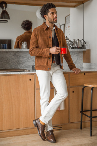 Brown Suede Shirt Jacket Outfits For Men: Such essentials as a brown suede shirt jacket and white jeans are the ideal way to infuse muted dapperness into your day-to-day styling routine. Kick up the wow factor of your look by sporting a pair of dark brown leather brogues.