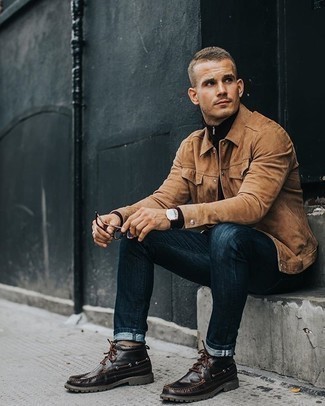 Dark Brown Zip Neck Sweater Outfits For Men: Dress in a dark brown zip neck sweater and navy jeans to put together a seriously sharp and modern-looking casual ensemble. The whole outfit comes together brilliantly when you add dark brown leather desert boots to the equation.
