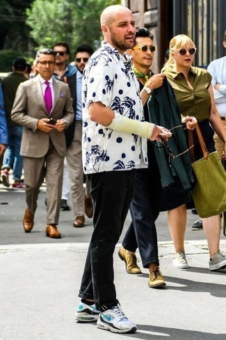 White and Black Print Short Sleeve Shirt Outfits For Men: If you would like take your off-duty look to a new height, wear a white and black print short sleeve shirt with black chinos. Go off the beaten path and switch up your look by rocking a pair of white athletic shoes.