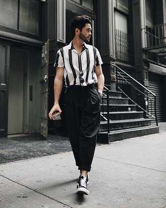 Black Canvas High Top Sneakers Outfits For Men: This pairing of a black and white vertical striped short sleeve shirt and black chinos looks put together and instantly makes any man look cool. For a more casual vibe, introduce a pair of black canvas high top sneakers to the equation.