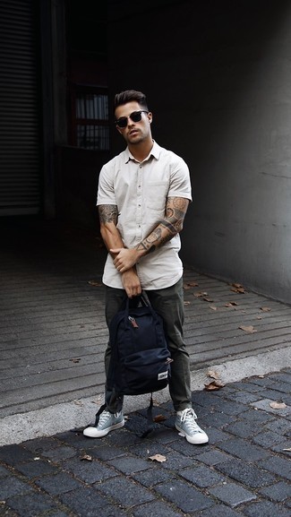 Men's White Short Sleeve Shirt, Dark Green Chinos, Light Blue Canvas High Top Sneakers, Navy Canvas Backpack