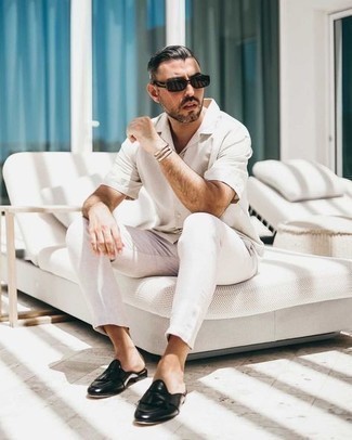 Black Fringe Leather Loafers Outfits For Men: To don a relaxed casual getup with a fashionable spin, consider wearing a white short sleeve shirt and white chinos. Inject an added touch of style into this look by rocking black fringe leather loafers.