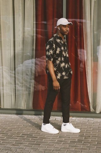 Black Print Short Sleeve Shirt Outfits For Men: This combo of a black print short sleeve shirt and black chinos speaks laid-back attitude and stylish practicality. White leather low top sneakers work spectacularly well with this look.