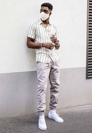 Men's White and Black Print Short Sleeve Shirt, Beige Chinos, White Canvas Low Top Sneakers, Silver Watch