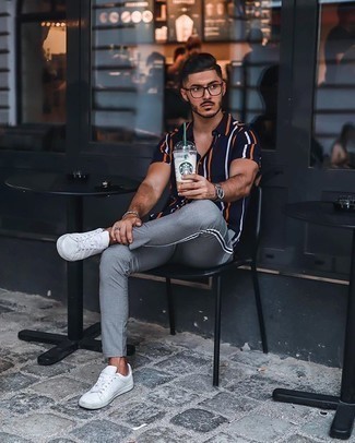 Men's Navy Vertical Striped Short Sleeve Shirt, Grey Chinos, White Canvas Low Top Sneakers, Clear Sunglasses