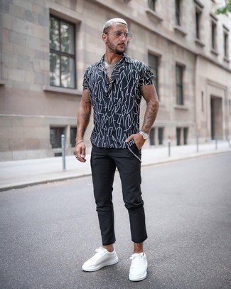 Men's White and Black Print Short Sleeve Shirt, Black Chinos, White Canvas Low Top Sneakers, Pink Sunglasses