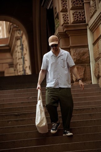 Beige Baseball Cap Outfits For Men: Something as simple as opting for a white short sleeve shirt and a beige baseball cap can potentially set you apart from the crowd. To bring out a sophisticated side of you, complement this look with a pair of black and white canvas low top sneakers.