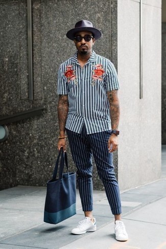 Men's White and Navy Vertical Striped Short Sleeve Shirt, Navy Vertical Striped Chinos, White and Navy Leather Low Top Sneakers, Navy Canvas Tote Bag