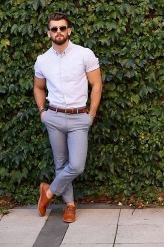 Pink Vertical Striped Short Sleeve Shirt Outfits For Men: A pink vertical striped short sleeve shirt and grey chinos paired together are a smart match. Add a more sophisticated twist to an otherwise mostly casual outfit with tobacco leather oxford shoes.