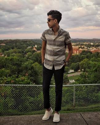 Black Sunglasses Outfits For Men: If you're after an urban but also sharp look, consider teaming a beige horizontal striped short sleeve shirt with black sunglasses. To introduce a little depth to this outfit, complement your ensemble with beige canvas slip-on sneakers.