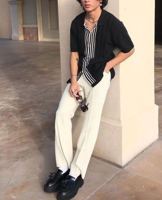 Dark Brown Sunglasses Outfits For Men: This combo of a black and white vertical striped short sleeve shirt and dark brown sunglasses spells versatility and casual menswear style. Black leather tassel loafers are a guaranteed way to breathe a dash of sophistication into this look.
