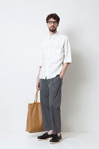 Tan Leather Tote Bag Outfits For Men: A white vertical striped short sleeve shirt and a tan leather tote bag are a smart look to add to your wardrobe. And if you need to instantly perk up your look with a pair of shoes, why not complete your look with black leather tassel loafers?