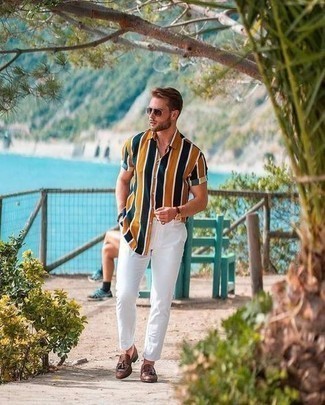 Brown Leather Tassel Loafers Outfits: No matter where the day takes you, you'll be stylishly ready in this laid-back combo of a multi colored vertical striped short sleeve shirt and white chinos. Go off the beaten path and switch up your look by finishing with a pair of brown leather tassel loafers.