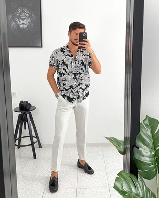 Charcoal Leather Tassel Loafers Outfits: A black and white floral short sleeve shirt and white chinos are a good look worth incorporating into your daily casual wardrobe. You can get a little creative on the shoe front and add a pair of charcoal leather tassel loafers.