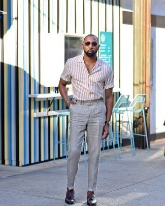 Dark Brown Leather Tassel Loafers Outfits: Step up your casual style in a pink vertical striped short sleeve shirt and grey vertical striped linen chinos. Breathe a dose of refinement into your outfit by finishing with dark brown leather tassel loafers.
