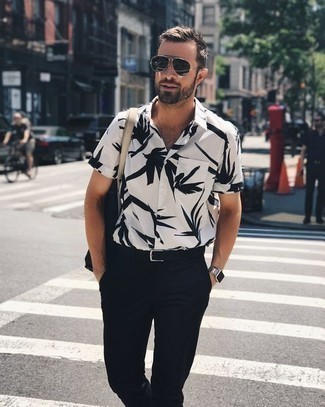 White and Black Print Short Sleeve Shirt Outfits For Men: If you're after an off-duty yet dapper outfit, consider teaming a white and black print short sleeve shirt with black chinos.