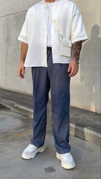 White Short Sleeve Shirt Outfits For Men: This combination of a white short sleeve shirt and navy chinos is super easy to imitate and so comfortable to rock a version of throughout the day as well! Bring a fun vibe to this outfit by slipping into white athletic shoes.