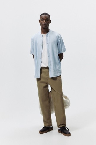 Tobacco Chinos Outfits: A light blue short sleeve shirt looks so cool when teamed with tobacco chinos in a casual getup. When it comes to shoes, introduce a pair of black and white leather low top sneakers to this look.