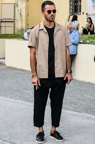 Tan Short Sleeve Shirt Outfits For Men: This combo of a tan short sleeve shirt and black chinos is hard proof that a straightforward casual ensemble doesn't have to be boring. Introduce black leather low top sneakers to the equation to pull the whole outfit together.