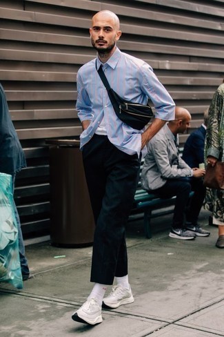 Black Canvas Fanny Pack Outfits For Men: Consider pairing a light blue vertical striped short sleeve shirt with a black canvas fanny pack to feel absolutely confident in yourself and look fashionable. Feeling creative today? Jazz up this outfit with a pair of white athletic shoes.