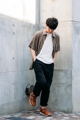 Brown Athletic Shoes Outfits For Men: A brown vertical striped short sleeve shirt and black chinos are a nice look to carry you throughout the day and into the night. Send this ensemble in a more casual direction by wearing a pair of brown athletic shoes.