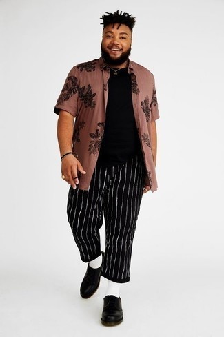 Black Vertical Striped Chinos Outfits: This on-trend outfit is easy to break down: a pink floral short sleeve shirt and black vertical striped chinos. Let your outfit coordination sensibilities truly shine by completing this getup with black leather derby shoes.