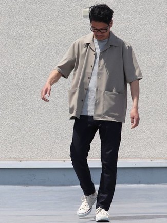 Tan Short Sleeve Shirt Outfits For Men: A tan short sleeve shirt and black chinos make for the perfect foundation for a casual and cool outfit. Now all you need is a pair of beige canvas low top sneakers.