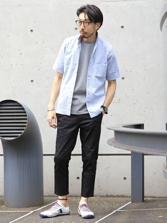Black Chinos Summer Outfits: This combination of a light blue short sleeve shirt and black chinos looks amazing and makes any man look infinitely cooler. When it comes to footwear, this outfit is finished off perfectly with white and navy canvas low top sneakers. We love that this look is great come warm sunny days.