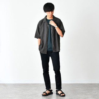 Charcoal Short Sleeve Shirt Outfits For Men: Make a charcoal short sleeve shirt and black chinos your outfit choice to confidently deal with whatever this day throws at you. Avoid looking too formal by rounding off with a pair of black canvas sandals.